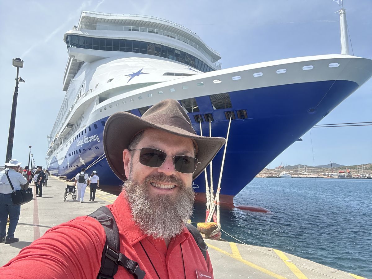 Joe McClane on the pier beside the pilgrimage cruise ship
