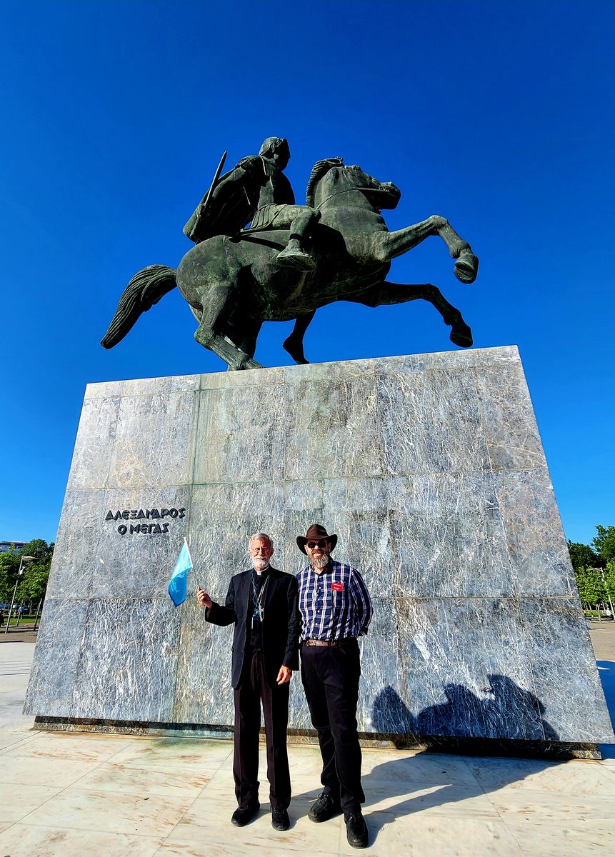 Joe McClane with Bishop Joseph Strickland beneath the Alexander the Great monument in Thessaloniki