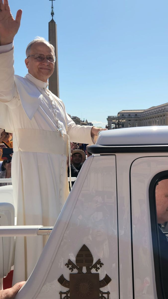 The Holy Father waving from the popemobile in St. Peter's Square